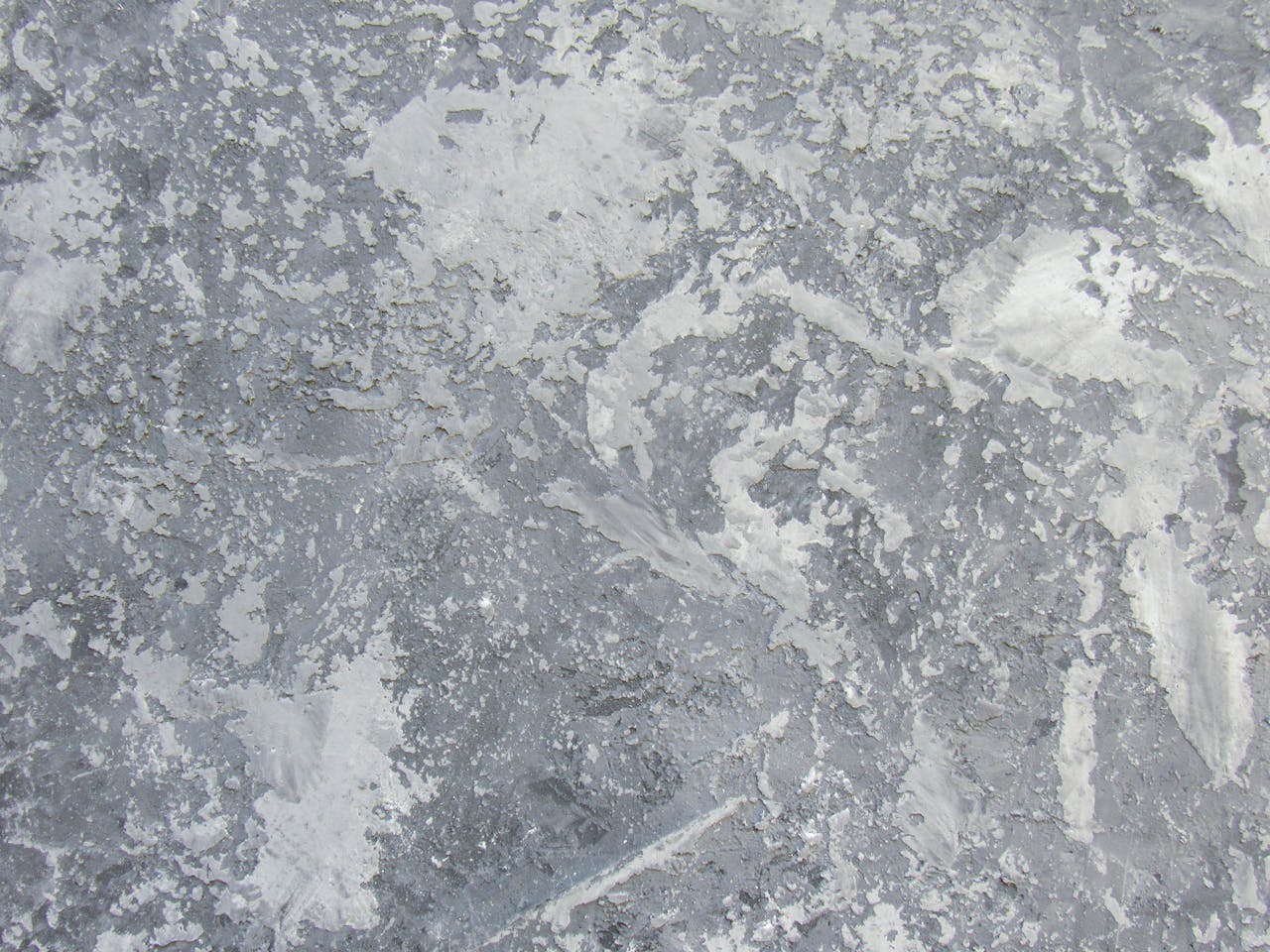 why-choose-us A detailed gray granite texture photo with rough surface patterns.