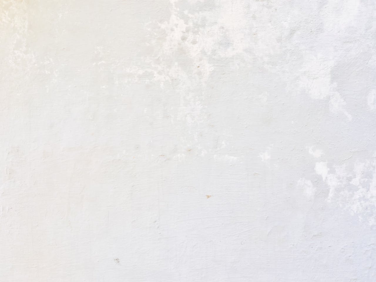 Crafting Captivating Headlines: Your awesome post title goes here Close-up of a white concrete wall with textured surface for backgrounds and design ideas.