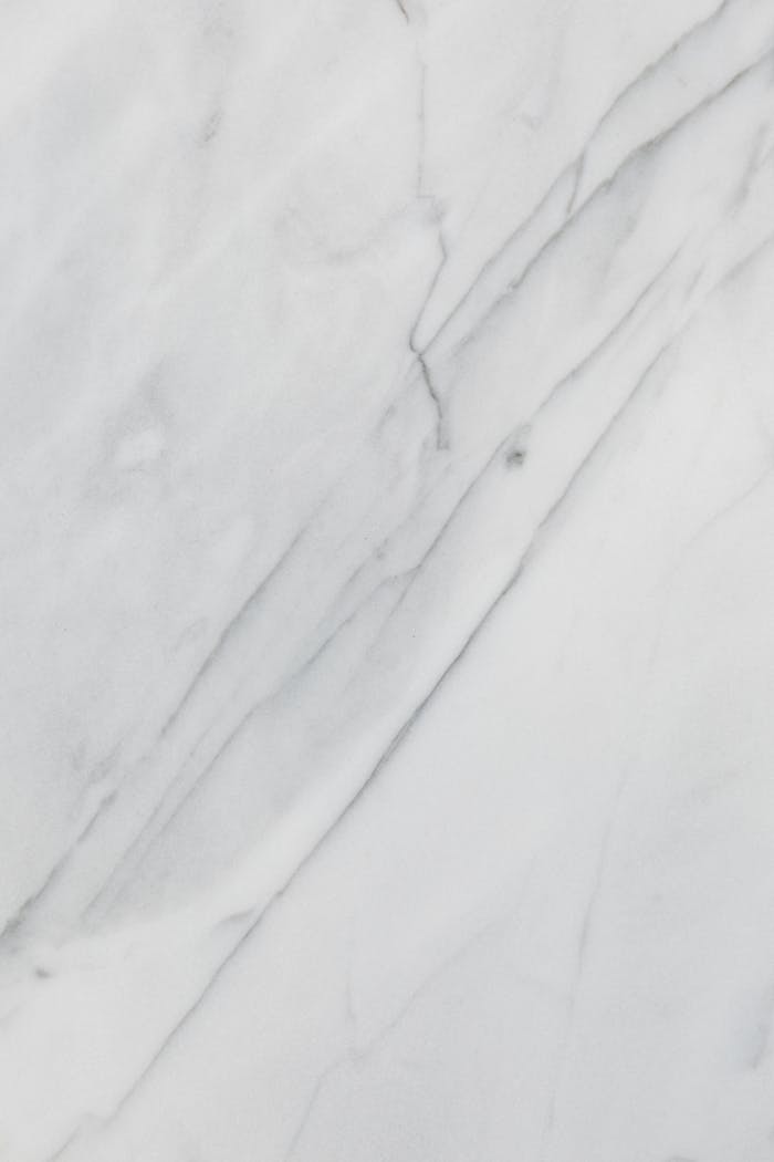 A smooth and elegant white marble texture, perfect for design use.